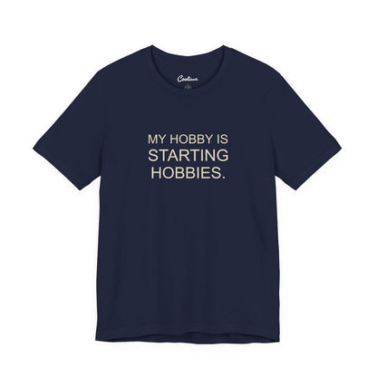 My Hobby Is Starting Hobbies Bella+Canvas3001 T-shirt in Navy, full front supplier flat lay.