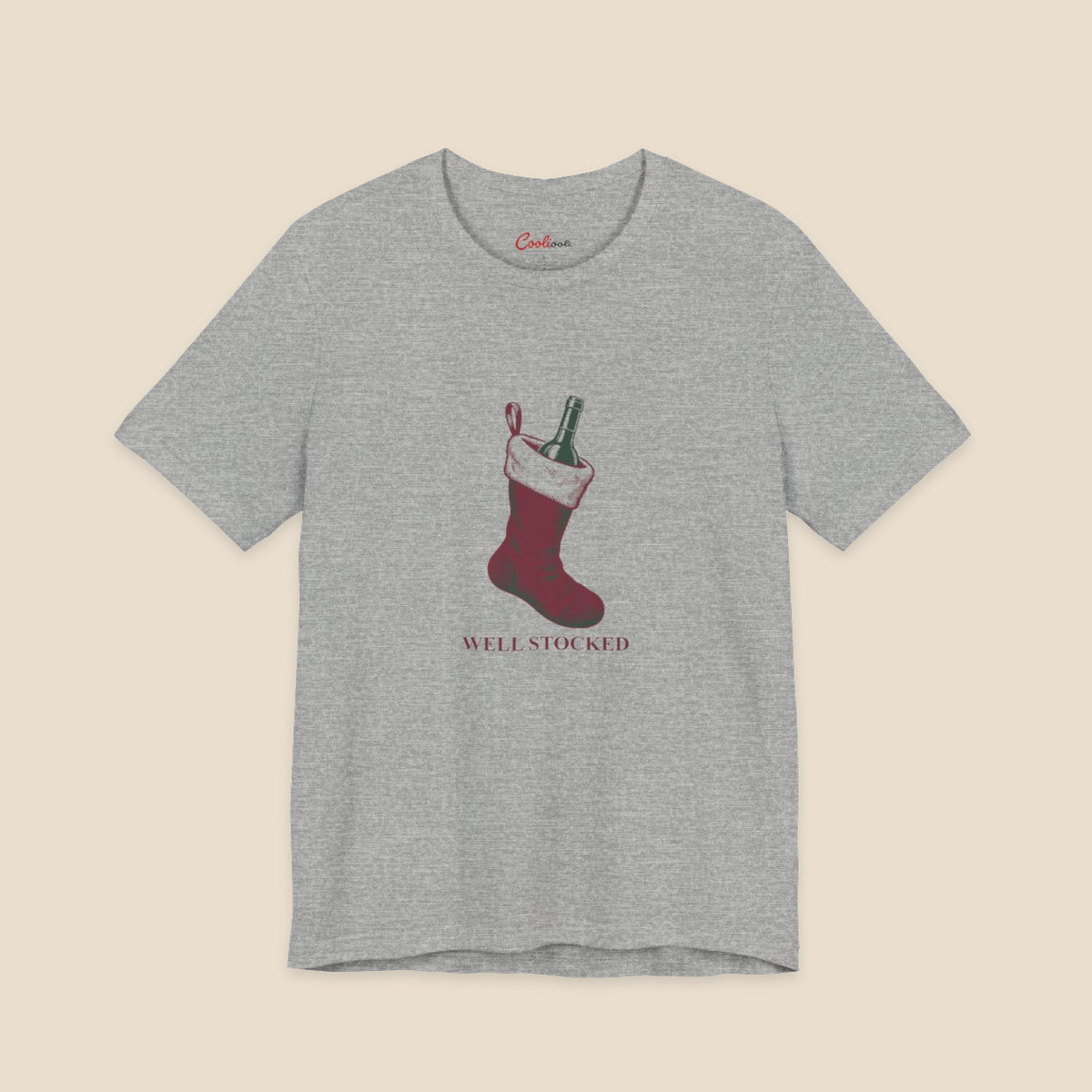 Athletic Heather Bella+Canvas3001 Well Stocked Christmas T-shirt with an original solid red wine-filled stocking illustration and serif lettering.