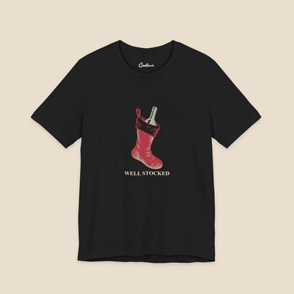 Black Bella+Canvas3001 Well Stocked Christmas T-shirt with an original solid red wine-filled stocking illustration and serif lettering.