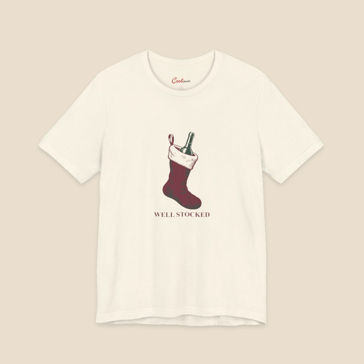 Natural Bella+Canvas3001 Well Stocked Christmas T-shirt with an original solid red wine-filled stocking illustration and serif lettering.