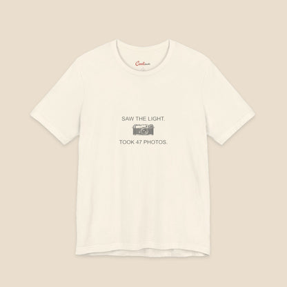 Saw the Light Took 47 Photos original camera graphic on the Natural Bella+Canvas3001 unisex tee; front colour preview.
