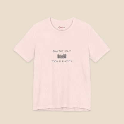 Saw the Light Took 47 Photos original camera graphic on the Soft Pink Bella+Canvas3001 unisex tee; front colour preview.