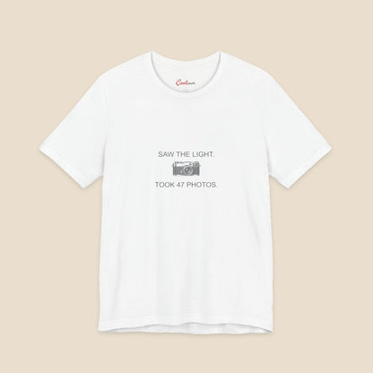 Saw the Light Took 47 Photos original camera graphic on the White Bella+Canvas3001 unisex tee; front colour preview.