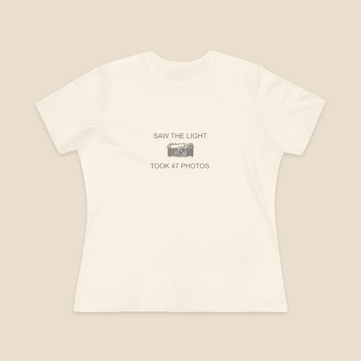Saw the Light Took 47 Photos original camera graphic on the Natural Bella+Canvas6400 women’s relaxed-fit tee; front colour preview.