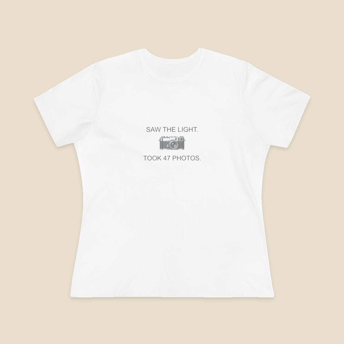 Saw the Light Took 47 Photos original camera graphic on the White Bella+Canvas6400 women’s relaxed-fit tee; front colour preview.