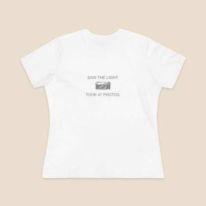 Saw the Light Took 47 Photos original camera graphic on the White Bella+Canvas6400 women’s relaxed-fit tee; front colour preview.