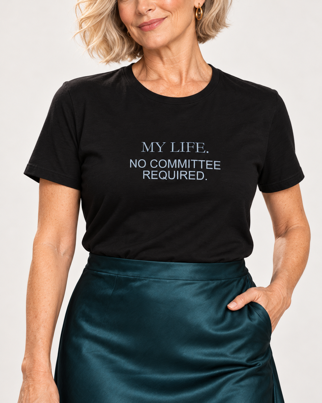 Collar-to-hip detail of the Black Bella+Canvas3001 unisex tee, with My Life No Committee Required pale blue-grey lettering and deep teal satin skirt.
