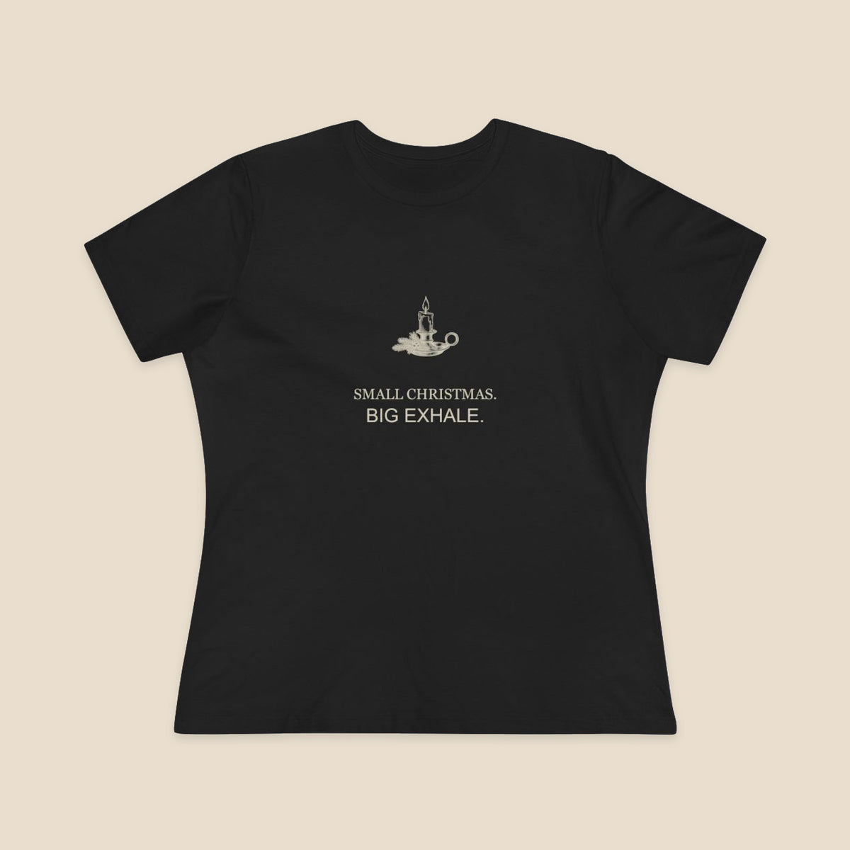 Small Christmas Big Exhale candle graphic on a Black Bella+Canvas 6400 women’s relaxed-fit tee; front colour preview.