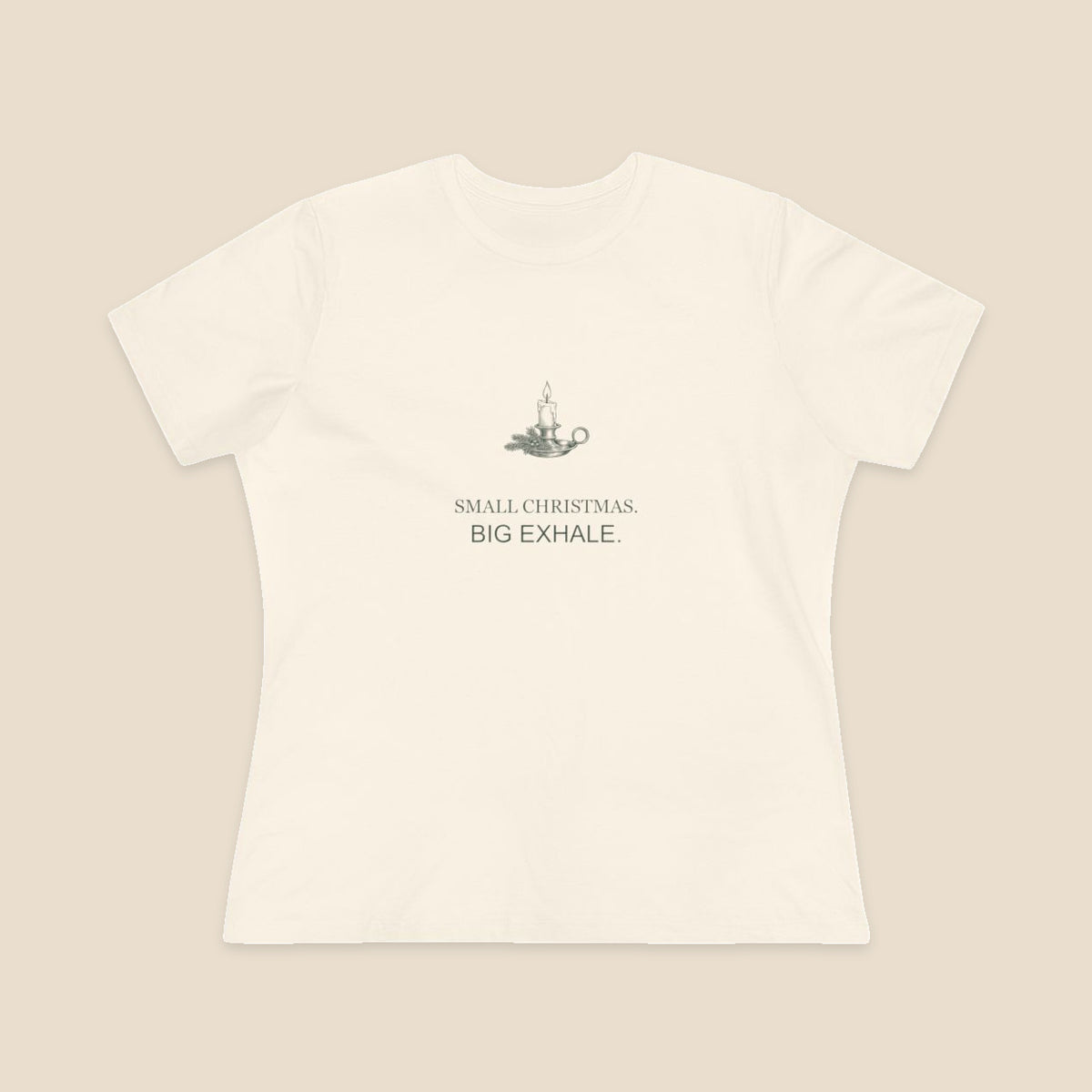 Small Christmas Big Exhale candle graphic on a Natural Bella+Canvas 6400 women’s relaxed-fit tee; front colour preview.