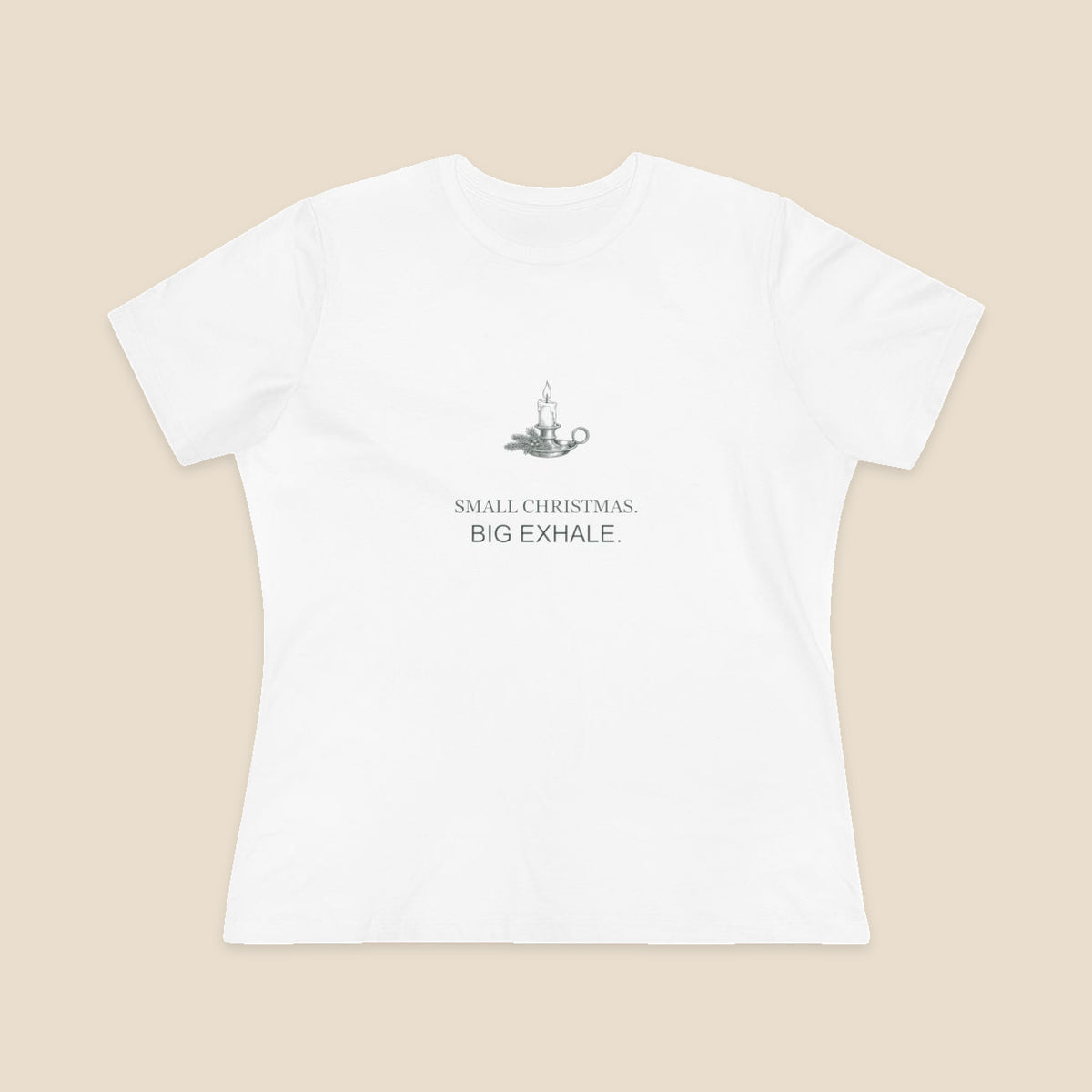 Small Christmas Big Exhale candle graphic on a White Bella+Canvas 6400 women’s relaxed-fit tee; front colour preview.