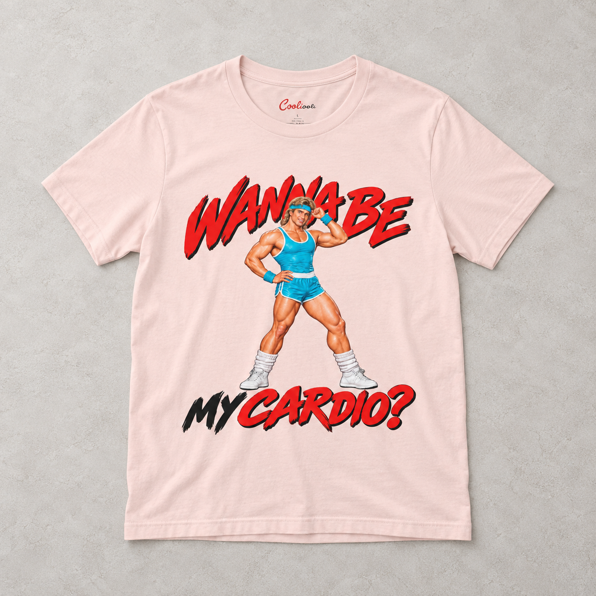 Soft Pink Wanna Be My Cardio Bella+Canvas 3001 tee, overhead flat lay showing the retro male aerobics graphic.