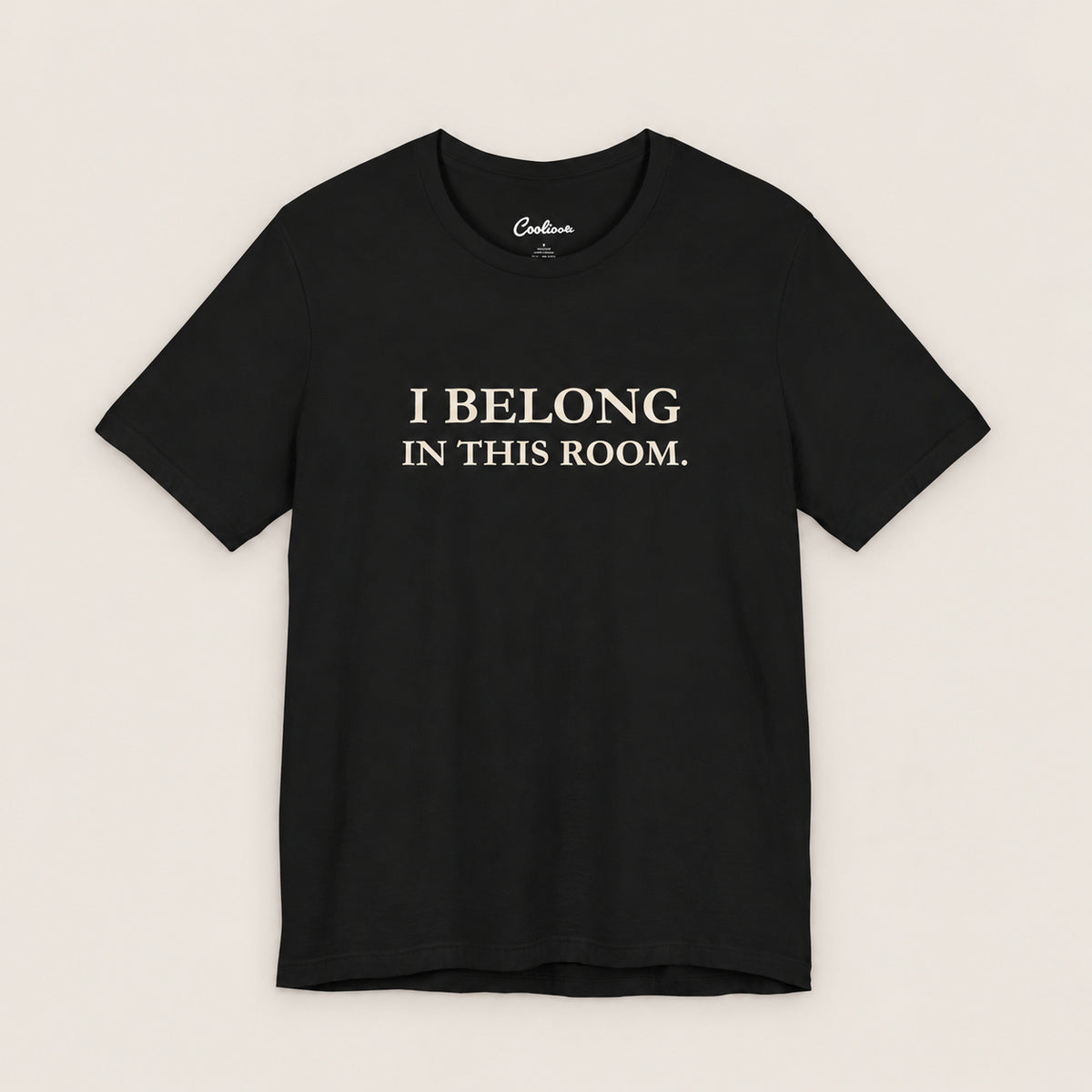 I BELONG IN THIS ROOM. Bella+Canvas3001 T-shirt in Black, front flat lay.