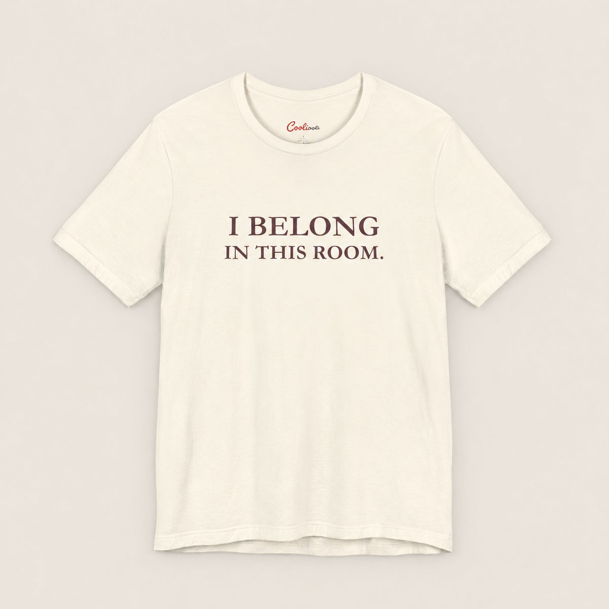 I BELONG IN THIS ROOM. Bella+Canvas3001 T-shirt in Natural, front flat lay.