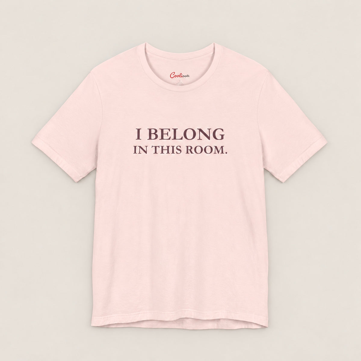 I BELONG IN THIS ROOM. Bella+Canvas3001 T-shirt in Soft Pink, front flat lay.