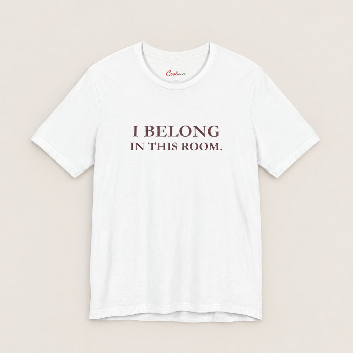 I BELONG IN THIS ROOM. Bella+Canvas3001 T-shirt in White, front flat lay.