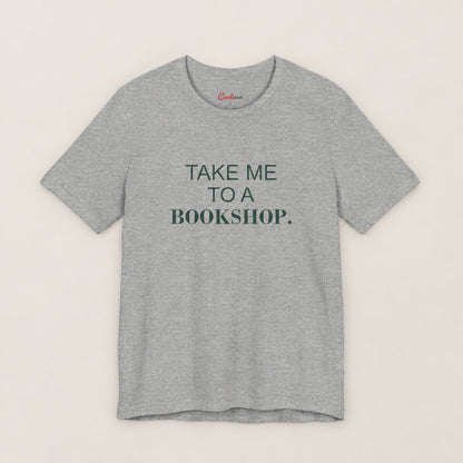 TAKE ME TO A BOOKSHOP. Bella+Canvas3001 T-shirt in Athletic Heather, front flat lay.
