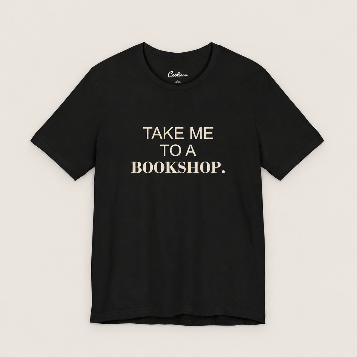 TAKE ME TO A BOOKSHOP. Bella+Canvas3001 T-shirt in Black, front flat lay.