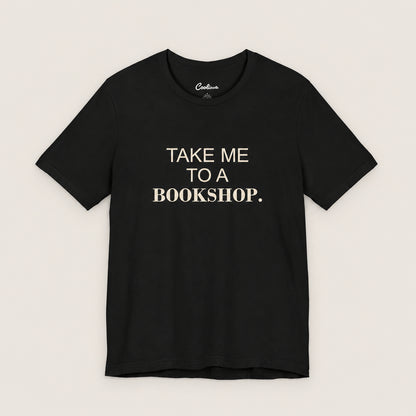 TAKE ME TO A BOOKSHOP. Bella+Canvas3001 T-shirt in Black, front flat lay.