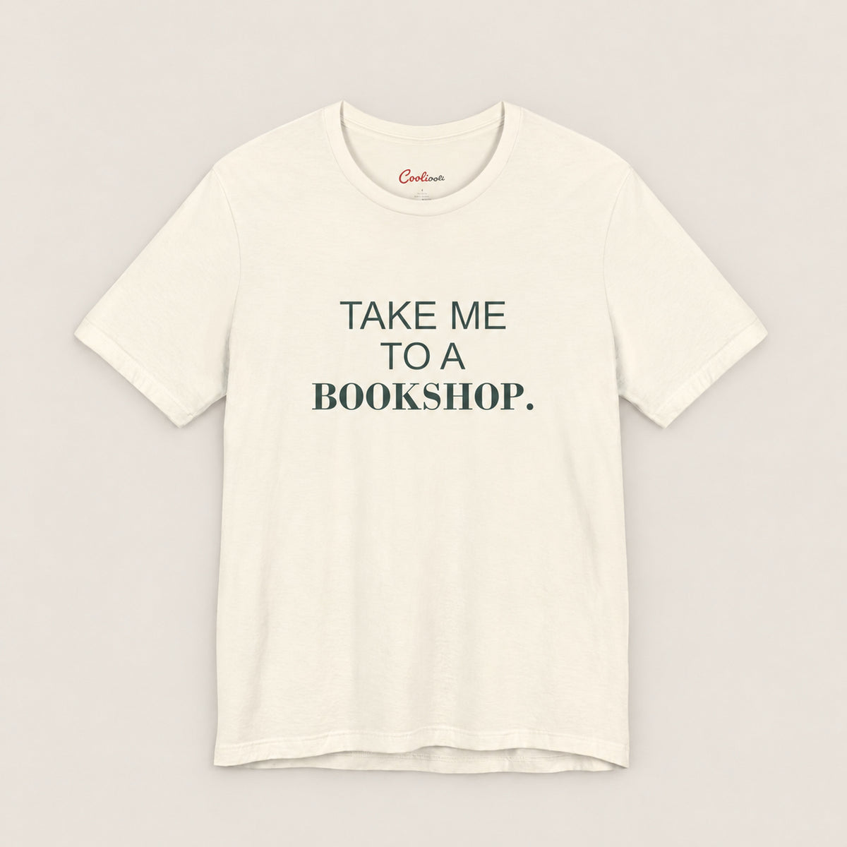 TAKE ME TO A BOOKSHOP. Bella+Canvas3001 T-shirt in Natural, front flat lay.