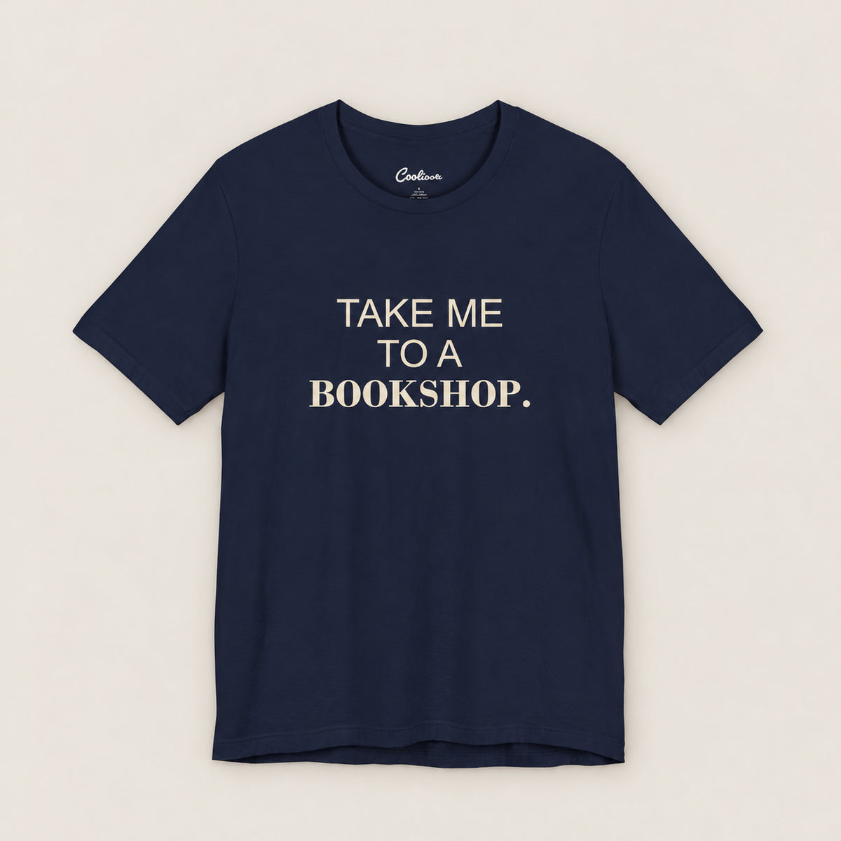 TAKE ME TO A BOOKSHOP. Bella+Canvas3001 T-shirt in Navy, front flat lay.