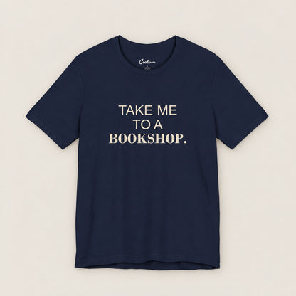 TAKE ME TO A BOOKSHOP. Bella+Canvas3001 T-shirt in Navy, front flat lay.