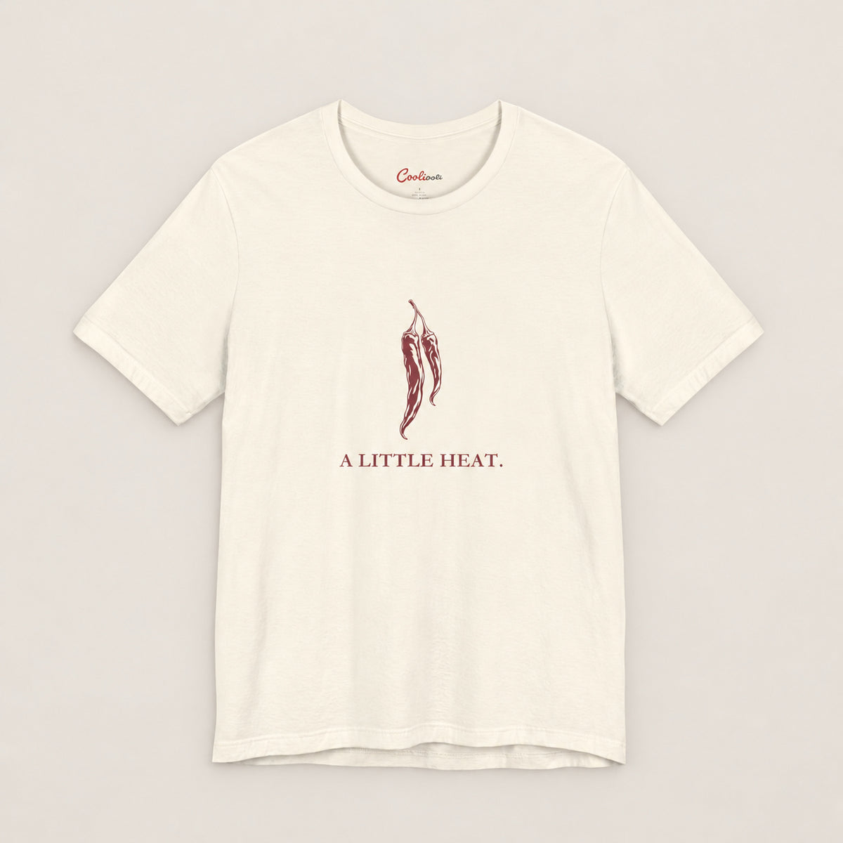 A LITTLE HEAT. Bella+Canvas3001 T-shirt in Natural, front flat lay.