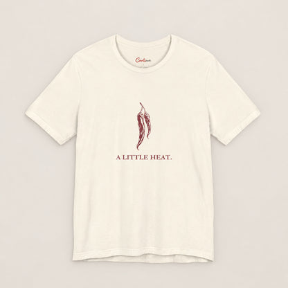 A LITTLE HEAT. Bella+Canvas3001 T-shirt in Natural, front flat lay.