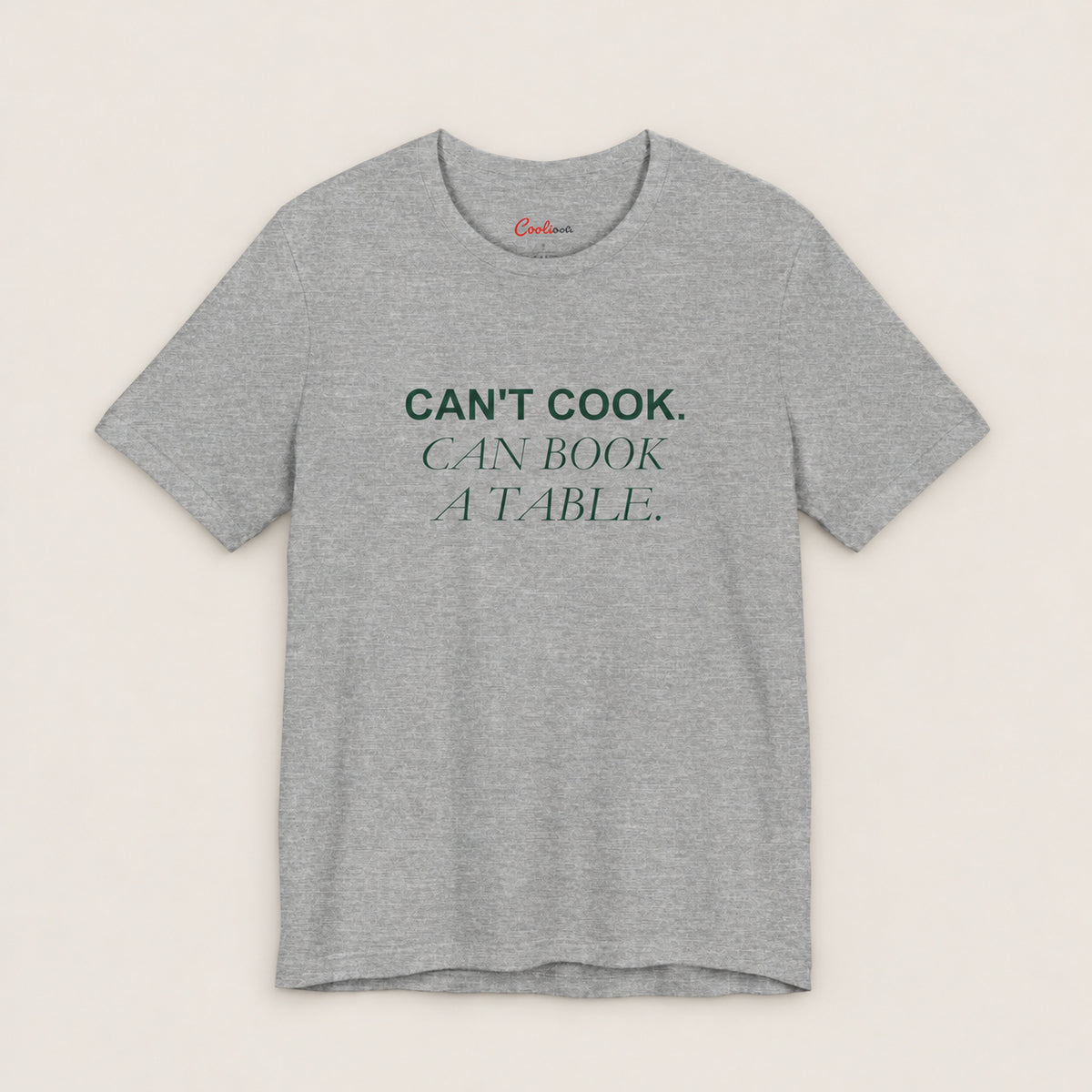 Can't Cook, Can Book a Table Bella+Canvas 3001 T-shirt in Athletic Heather, front flat lay.