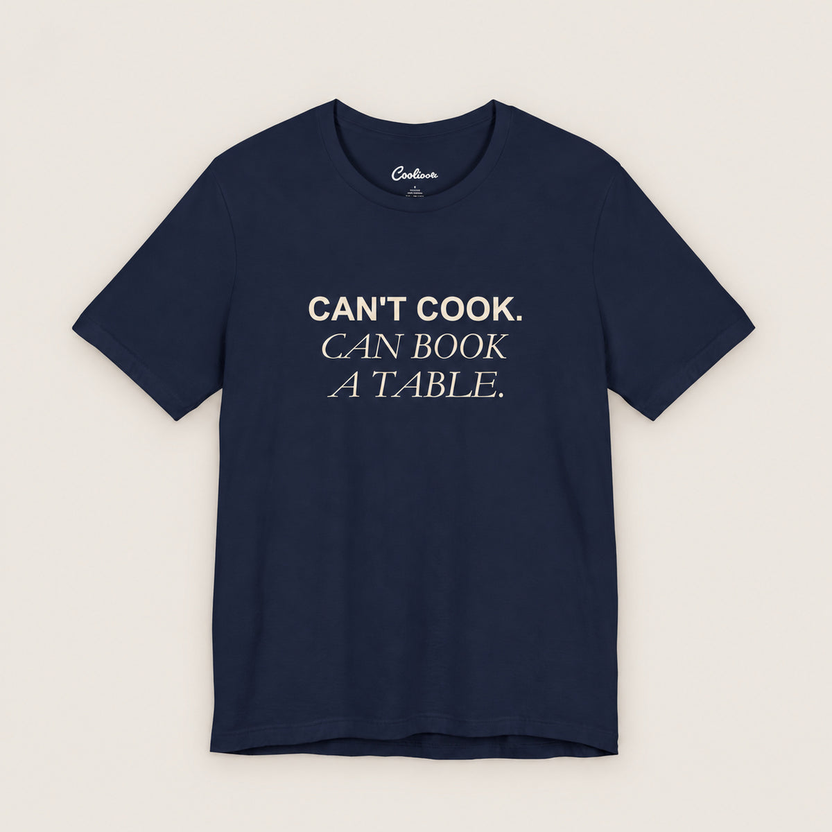Can't Cook, Can Book a Table Bella+Canvas 3001 T-shirt in Navy, front flat lay.