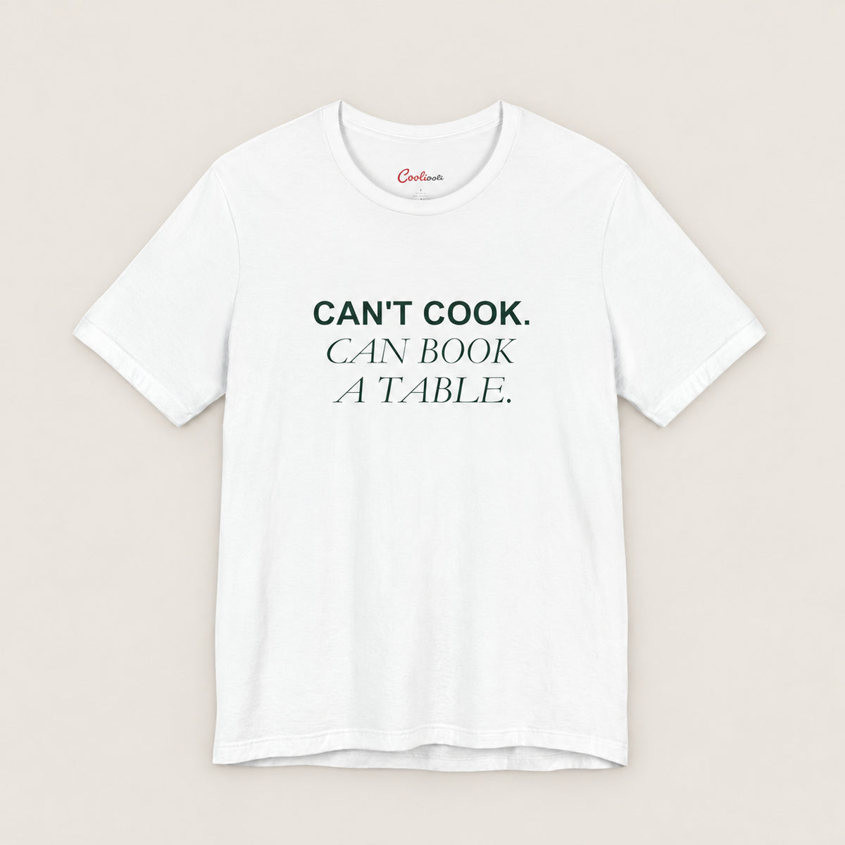 Can't Cook, Can Book a Table Bella+Canvas 3001 T-shirt in White, front flat lay.