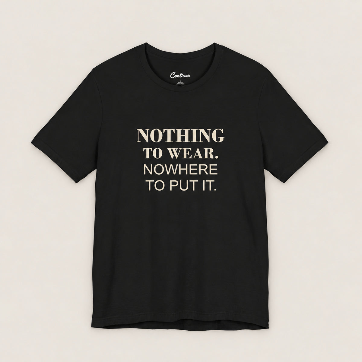 NOTHING TO WEAR. NOWHERE TO PUT IT. Bella+Canvas3001 T-shirt in Black, front flat lay.