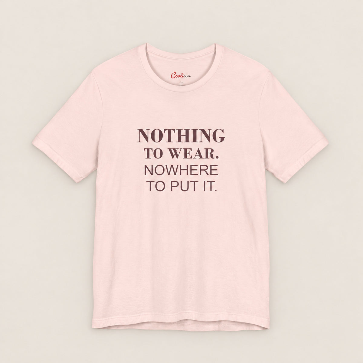 NOTHING TO WEAR. NOWHERE TO PUT IT. Bella+Canvas3001 T-shirt in Soft Pink, front flat lay.