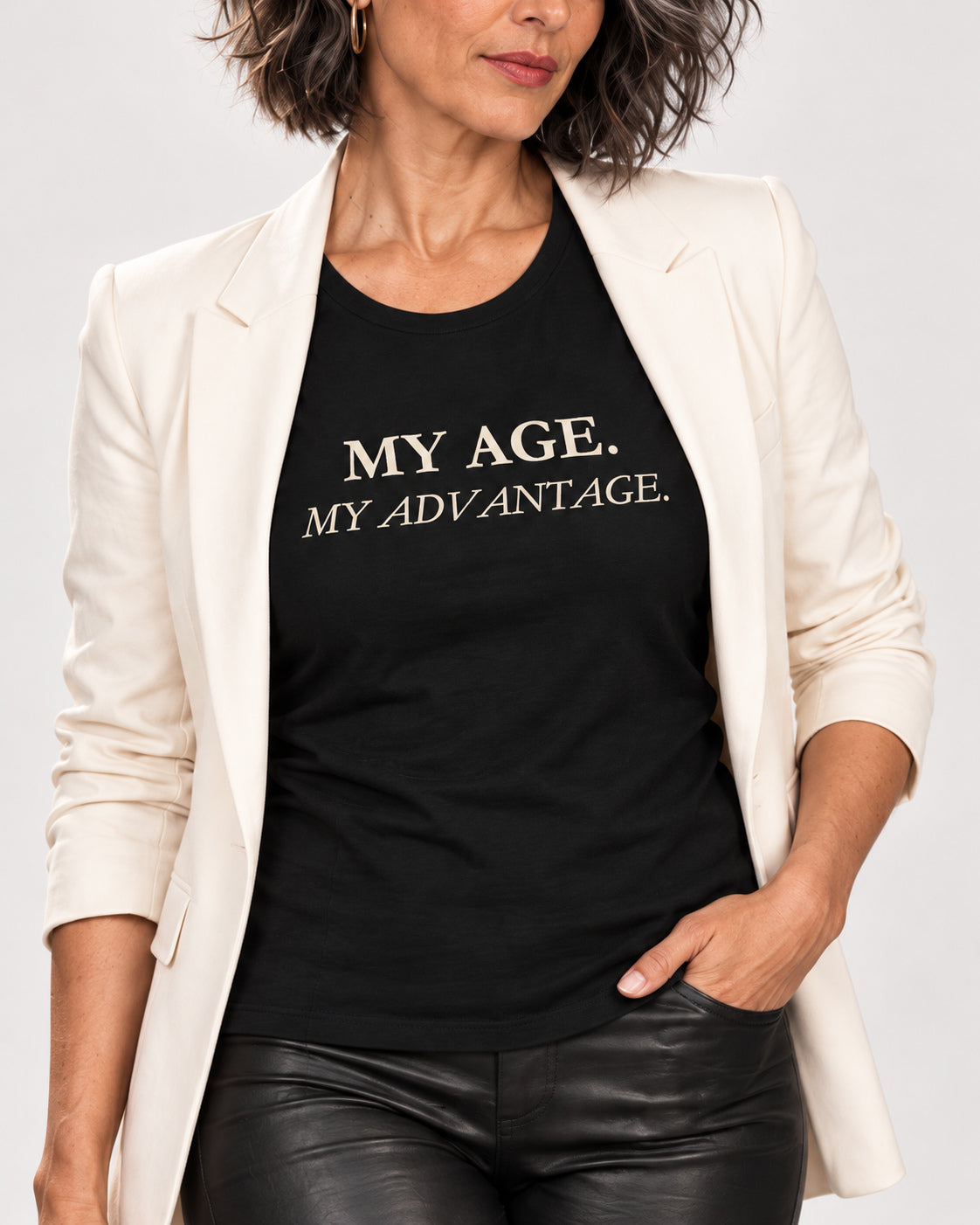 Close-up of Freya's Black My Age My Advantage tee showing ivory lettering printed into cotton jersey