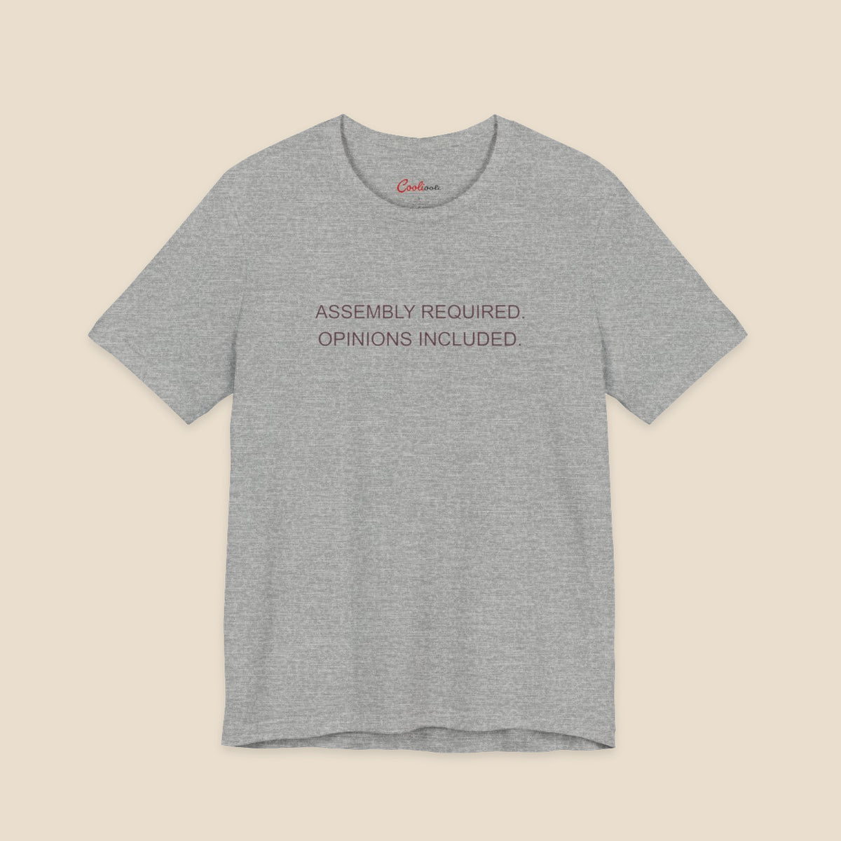 Athletic Heather Bella+Canvas 3001 T-shirt with Assembly Required. Opinions Included. printed in two clean sans-serif lines.
