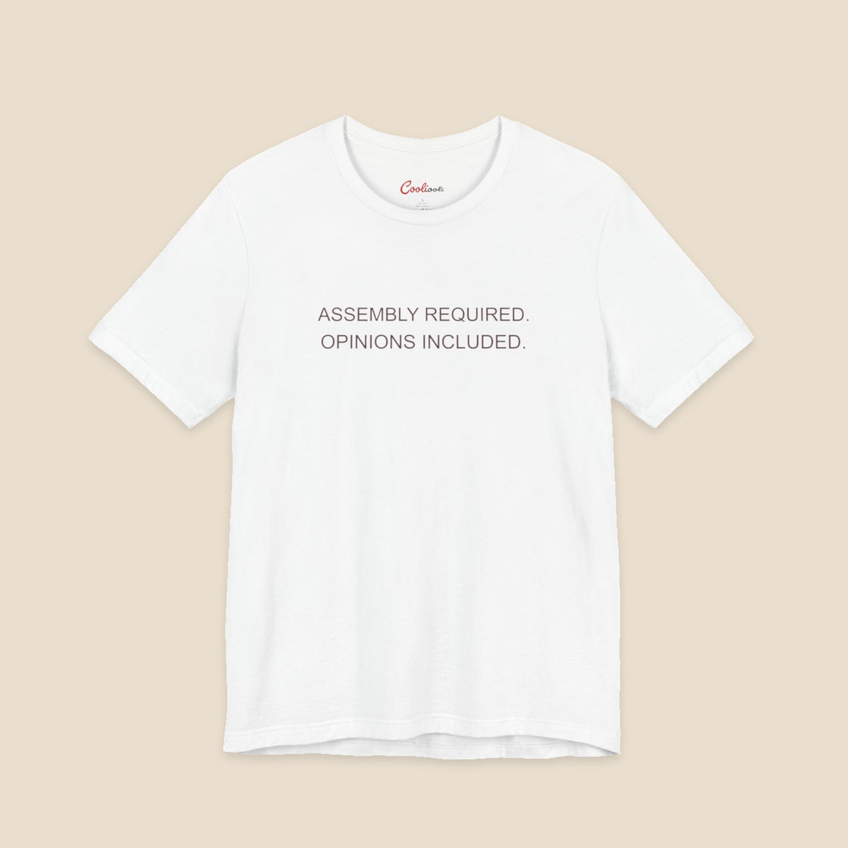 White Bella+Canvas 3001 T-shirt with Assembly Required. Opinions Included. printed in two clean sans-serif lines.