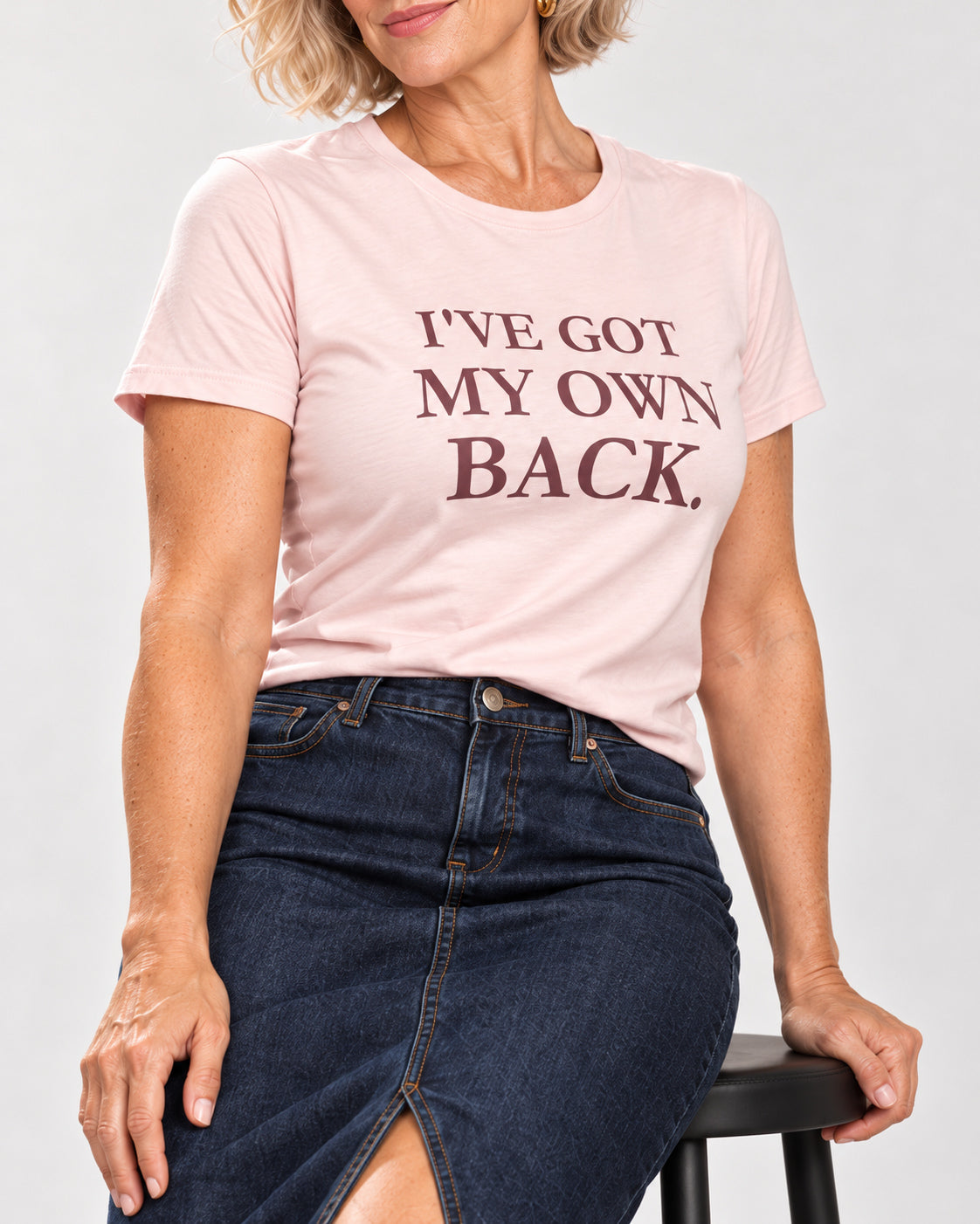 Claudia in the Soft Pink I'VE GOT MY OWN BACK. tee — collar-to-hip detail showing the print on softly draped cotton.