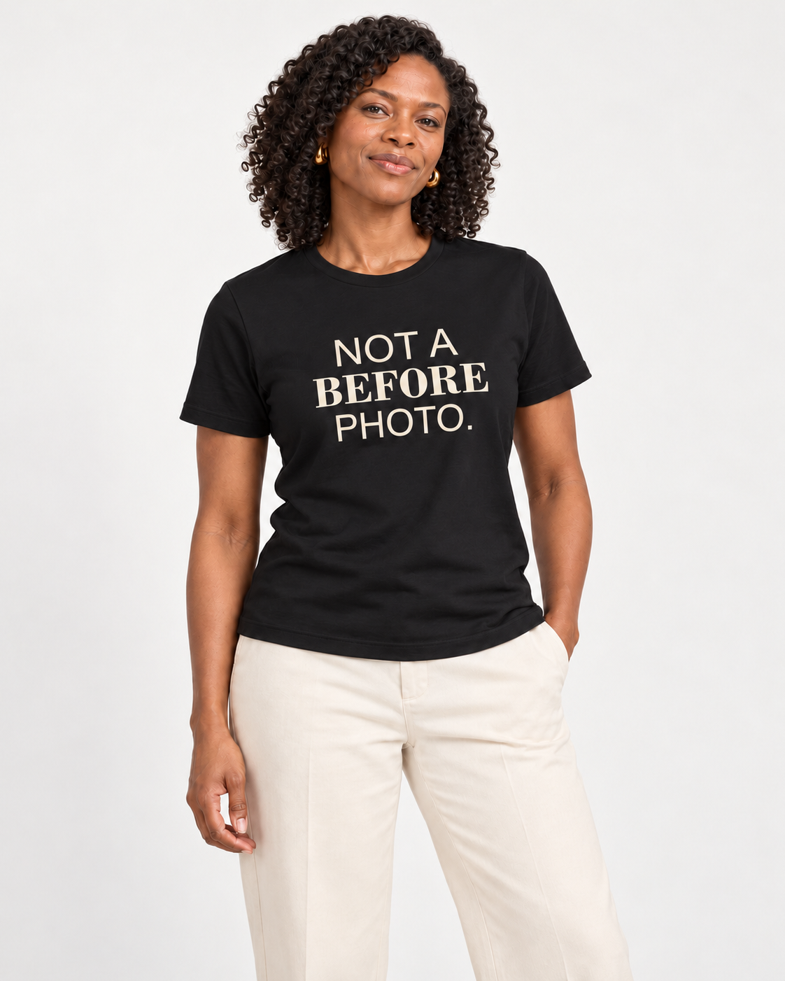 Amara wearing the Black NOT A BEFORE PHOTO. Bella+Canvas 3001 tee in a natural studio portrait