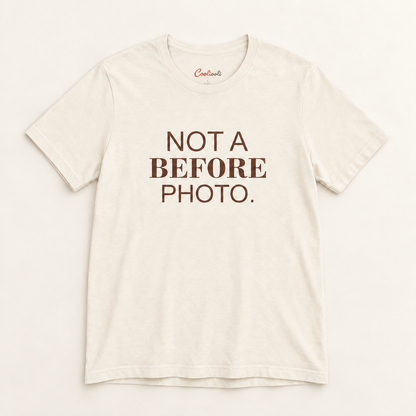 NOT A BEFORE PHOTO. Bella+Canvas 3001 tee in Natural, overhead view on a plain warm neutral studio background