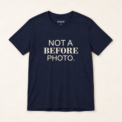 NOT A BEFORE PHOTO. Bella+Canvas 3001 tee in Navy, overhead view on a plain warm neutral studio background