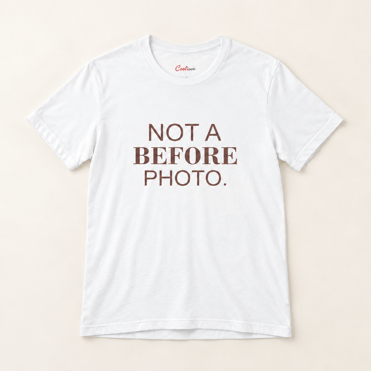 NOT A BEFORE PHOTO. Bella+Canvas 3001 tee in White, overhead view on a plain warm neutral studio background