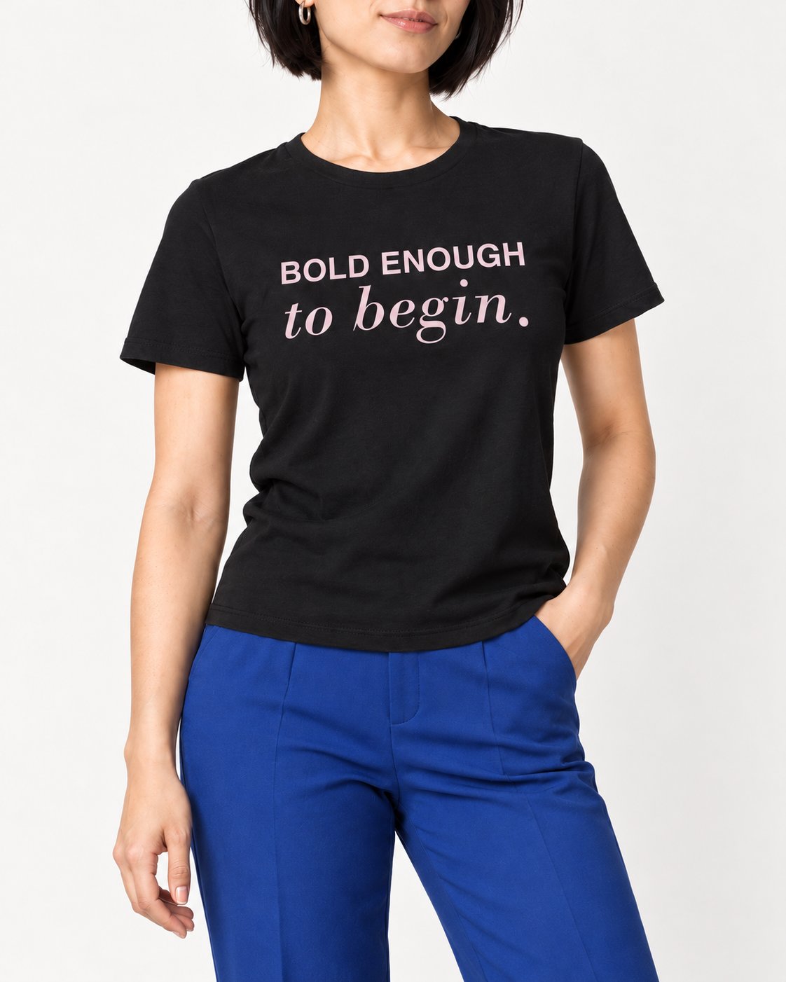 Mina wearing the Black Her Next Chapter Starts Here. Bella+Canvas 3001 tee — collar-to-hip detail