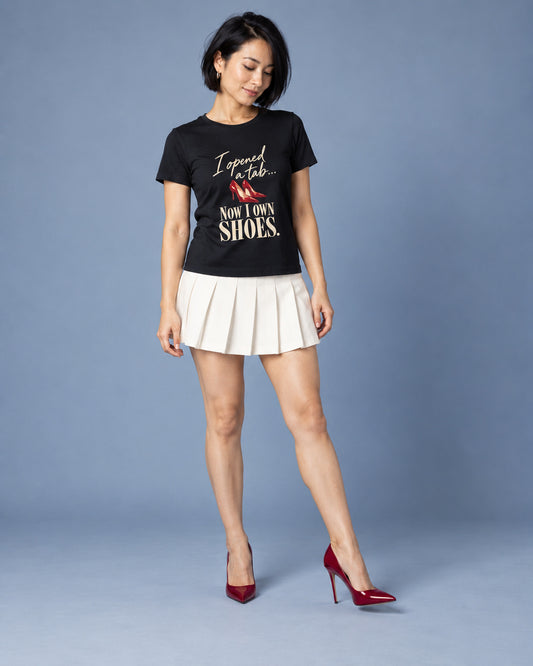 Mina wearing the Black Just Browsing, Apparently. Bella+Canvas crew-neck tee in a styled professional studio photograph