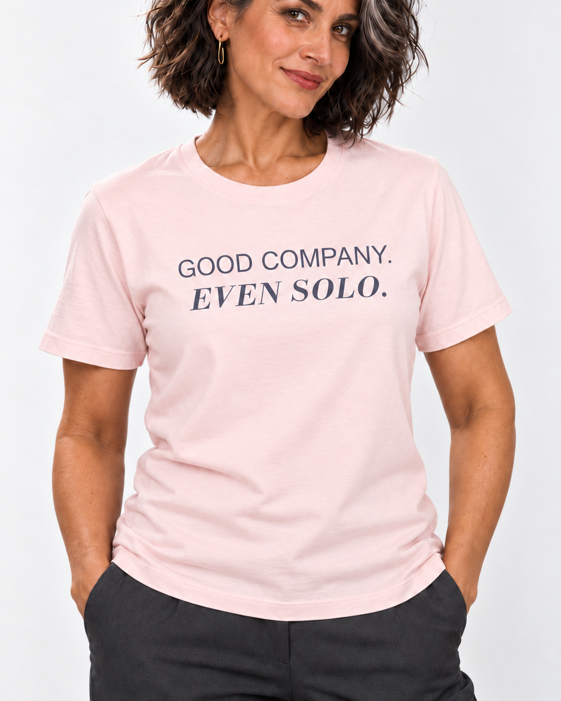 Freya wearing the Soft Pink GOOD COMPANY. EVEN SOLO. Bella+Canvas 3001 tee — collar-to-hip print detail