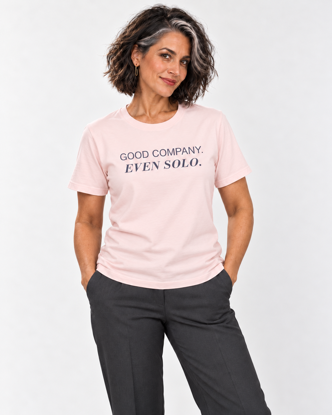 Freya wearing the Soft Pink GOOD COMPANY. EVEN SOLO. Bella+Canvas 3001 tee in a natural studio portrait