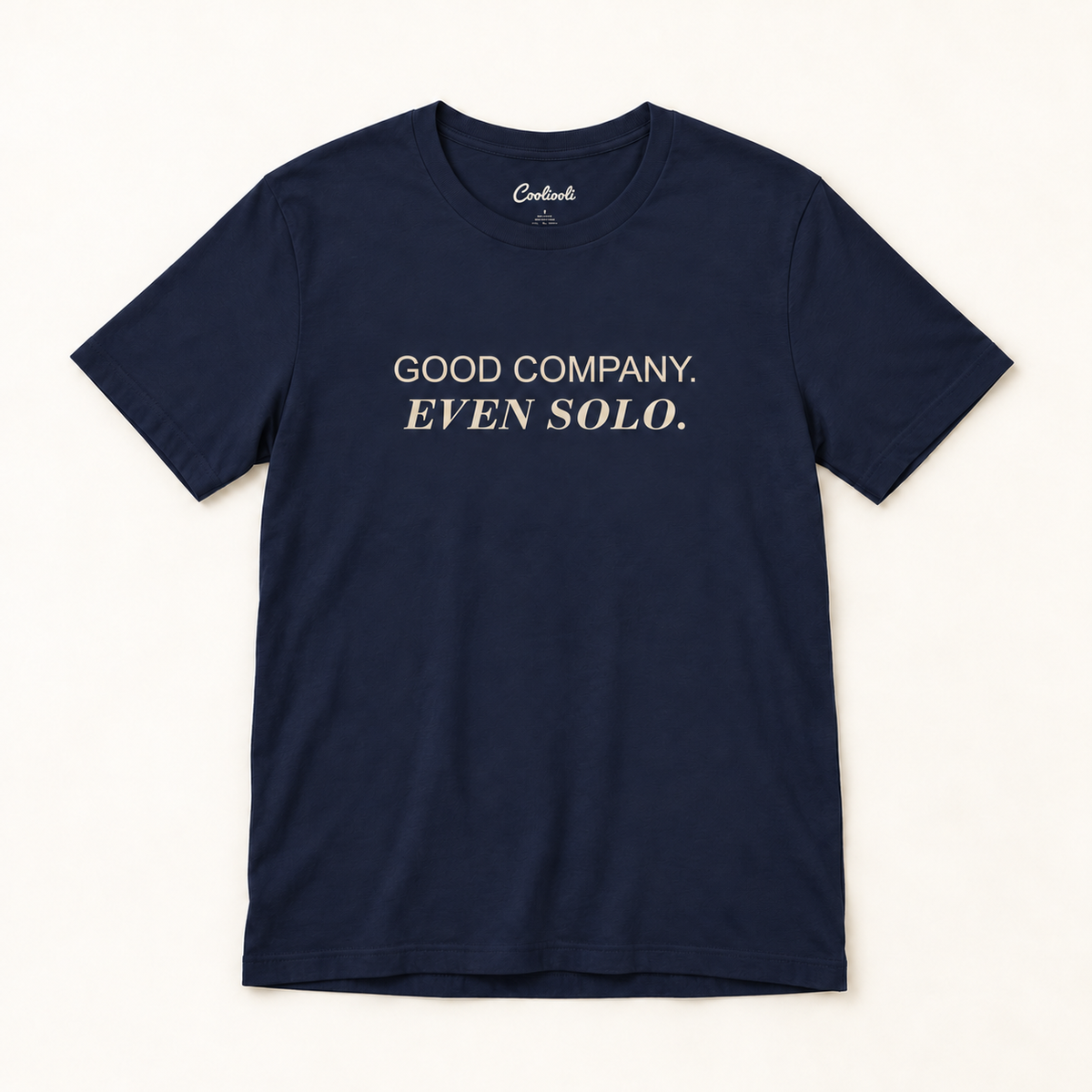 GOOD COMPANY. EVEN SOLO. Bella+Canvas 3001 tee in Navy, overhead view on a plain warm neutral studio background
