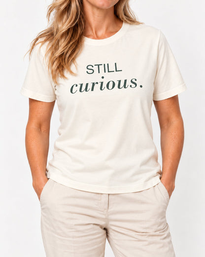 Elena wearing the Natural She Has More to Discover. Bella+Canvas 3001 tee — collar-to-hip detail