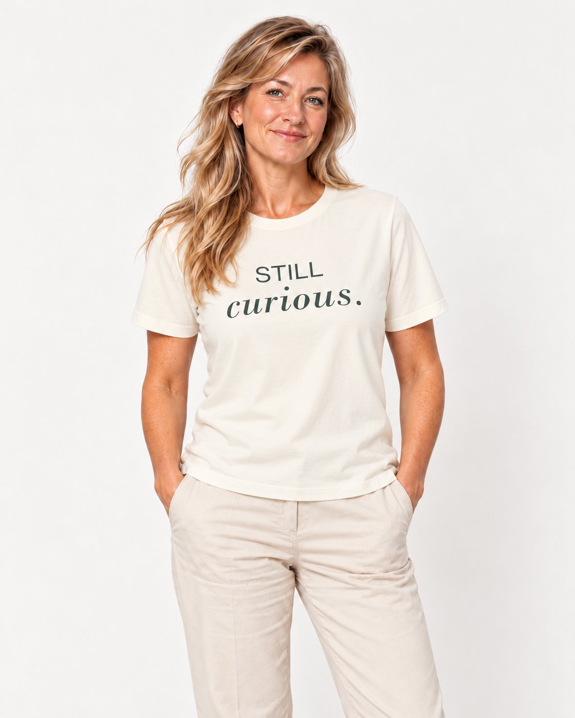 Elena wearing the Natural She Has More to Discover. Bella+Canvas 3001 tee — natural studio portrait