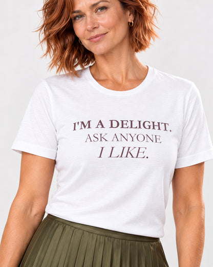 Close-up of I'm a Delight Ask Anyone I Like printed on the white Bella Canvas 3001 T-shirt