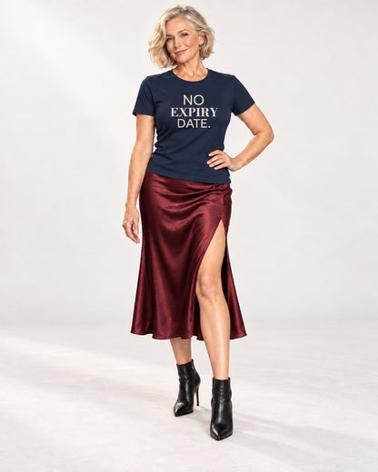 Claudia wearing the Navy NO EXPIRY DATE. Bella+Canvas 3001 tee — full-length natural studio outfit