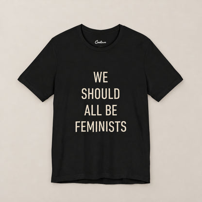 We Should All Be Feminists Bella+Canvas 3001 T-shirt in Black, front flat lay.